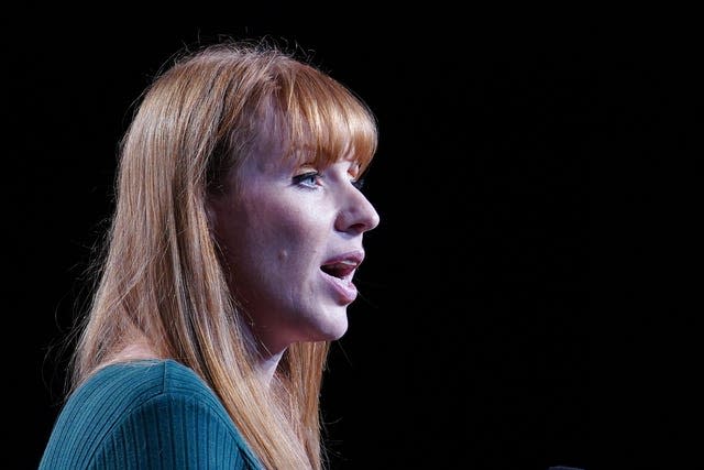 A head and shoulders shot of Angela Rayner aginst a black backdrop