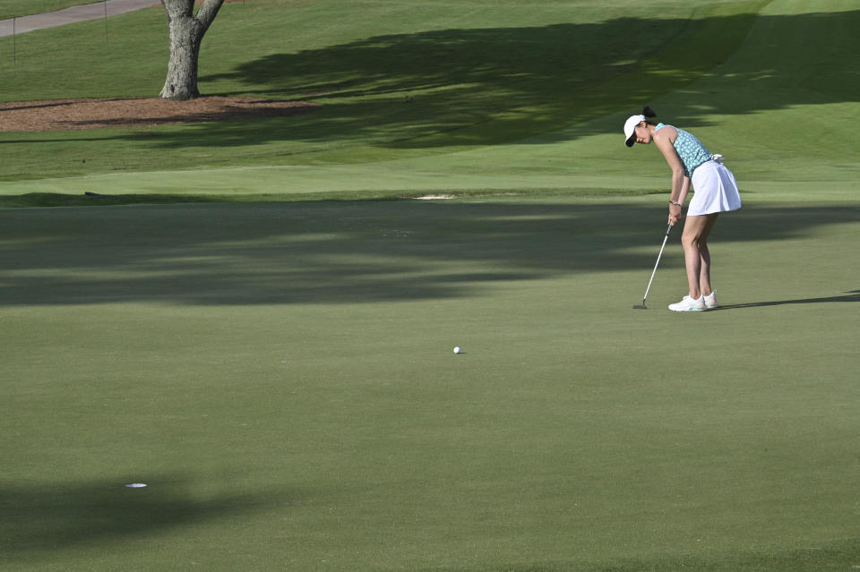 Michelle Wie West putts on the 10th green during Round 1 of 2021 KPMG Women's PGA Championship at Atlanta Athletic Club in Johns Creek, Ga., Thursday, June 24, 2021. (Hyosub Shin/Atlanta Journal-Constitution via AP)