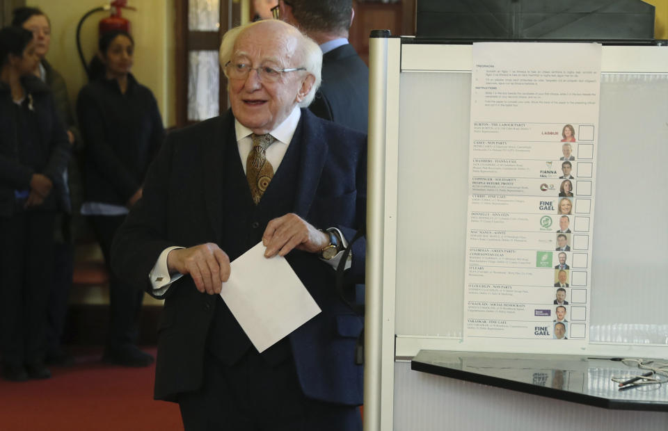 Ireland's President Michael D Higgins prepares to cast his vote for the Irish General Election, in Dublin, Ireland, Saturday Feb. 8, 2020. Voting is under way in Ireland for what is widely predicted to be an unpredictable outcome.(Brian Lawless/PA via AP)