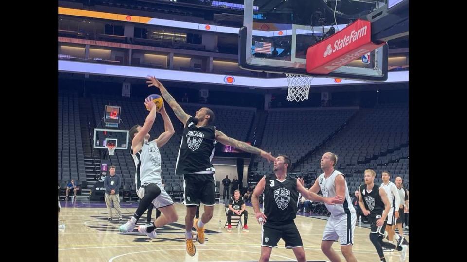 Former Sacramento Kings guard Jimmer Fredette hangs in the air for Team Miami to make a tough bankshot over James Parrott of Team Omaha on Sunday, Oct. 1.