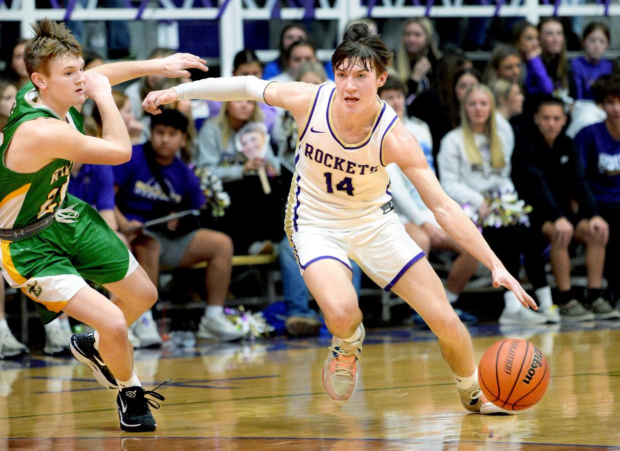 Routt Catholic's Bryson Mossman drives the ball down court during the game against Brown County Friday, February 9, 2024.