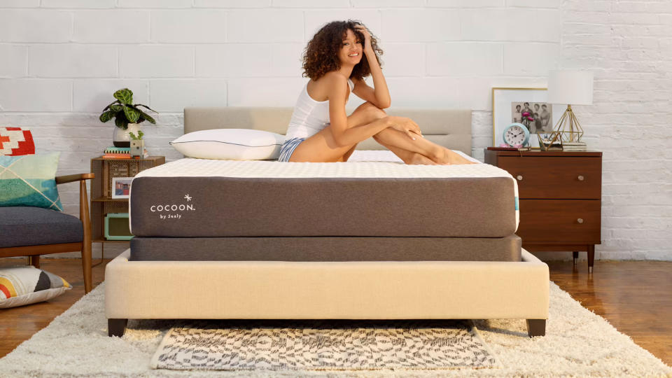 Cocoon Chill memory foam mattress review: girl sitting in the middle of the bed