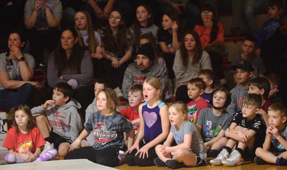 Young wrestling fans watch Wednesday's dual meet between General McLane and Fort LeBoeuf. The meet included first all-girls matches between Erie County teams since the PIAA sanctioned the sport last summer.