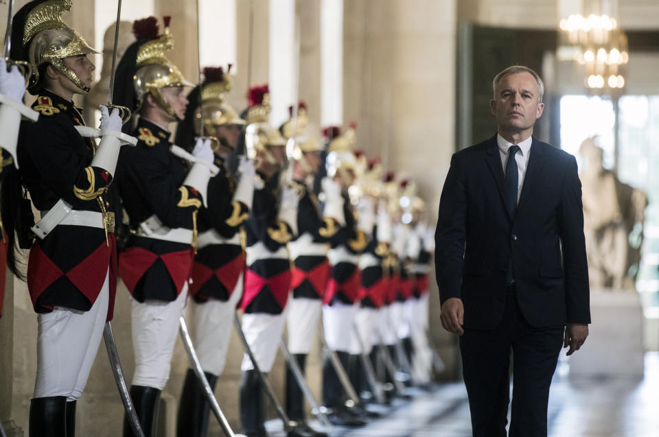 FILE - In this July 3, 2017 file photo, then French Parliament President Francois de Rugy walks through the galerie des Bustes (Busts gallery) at the Chateau de Versailles, outside Paris. Francois de Rugy resigned Tuesday July 16, 2019 over reports of publicly funded lavish lifestyle. (Etienne Laurent/Pool Photo via AP, File)