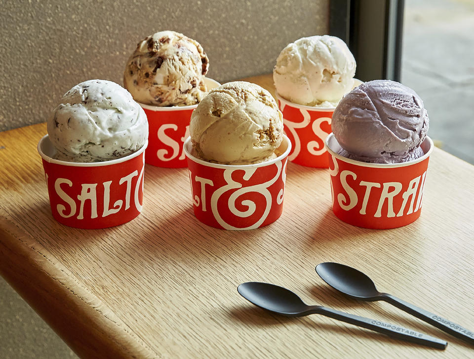 This image provided by Salt & Straw shows a variety of the West Coast ice creamery's unique flavors. The company offers interesting combos like Pistachio with Saffron, and Hibiscus and Coconut. Others sound like a warm hug in gelid form: Jasmine Milk Tea laced with chocolate-coated almond slivers, or Rhubarb Crumble with Toasted Anise. (Salt & Straw via AP)