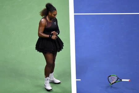 Sep 8, 2018; New York, NY, USA; Serena Williams of the United States smashes her racket during the women's final against Naomi Osaka of Japan (not pictured) on day thirteen of the 2018 U.S. Open tennis tournament at USTA Billie Jean King National Tennis Center. Danielle Parhizkaran-USA TODAY SPORTS