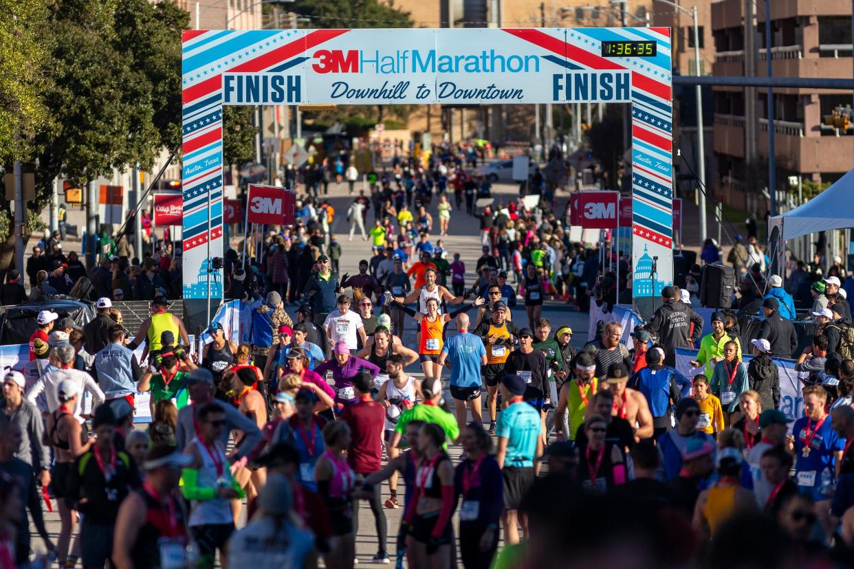 Runners finish the 3M Half Marathon in downtown, Austin, Sunday, Jan., 19, 2020. [Stephen Spillman for Statesman]