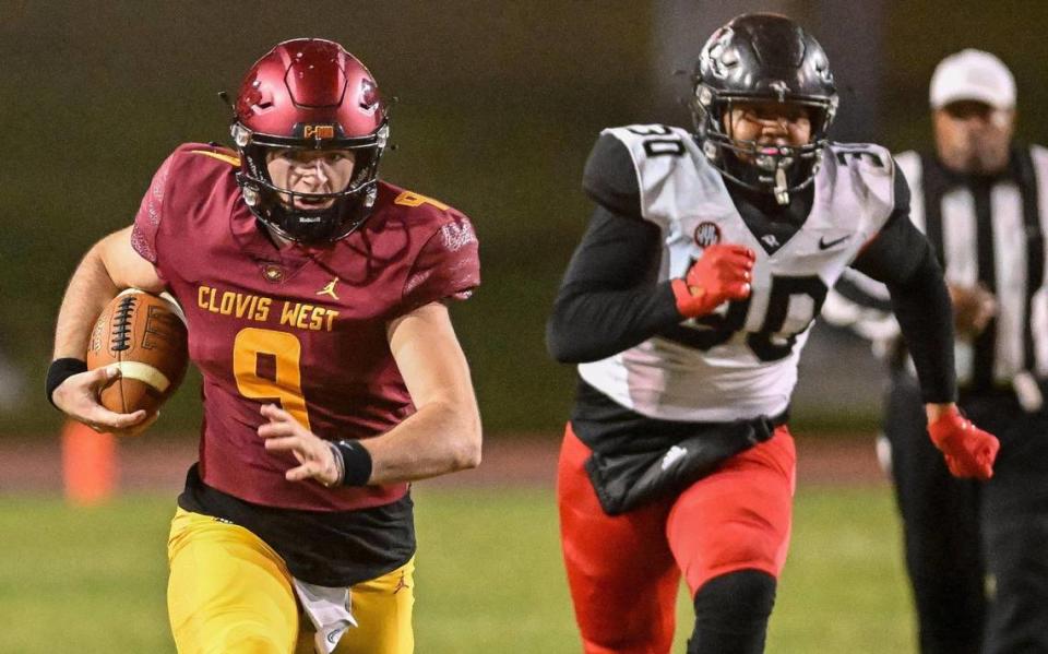 Clovis West quarterback Tyler Patrick charges down the middle of the field on a keeper against Hanford in their first-round Central Section playoff game at Veterans Memorial Stadium in Clovis on Friday, Nov. 3, 2023.