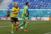 Sweden's Emil Forsberg celebrates after scoring his side's opening goal during the Euro 2020 soccer championship group E match between Sweden and Slovakia, at the Saint Petersburg stadium, in Saint Petersburg, Russia, Friday, June 18, 2021. (Anatoly Maltsev, Pool via AP)