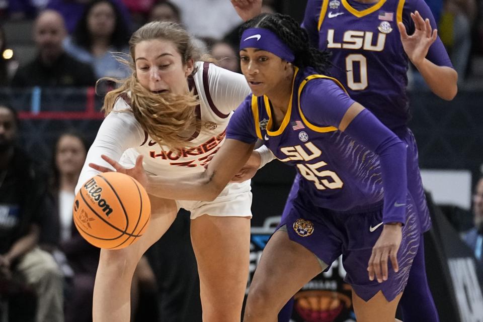 Virginia Tech's Elizabeth Kitley and LSU's Alexis Morris go after a loose ball during the first half of an NCAA Women's Final Four semifinals basketball game Friday, March 31, 2023, in Dallas. (AP Photo/Tony Gutierrez)