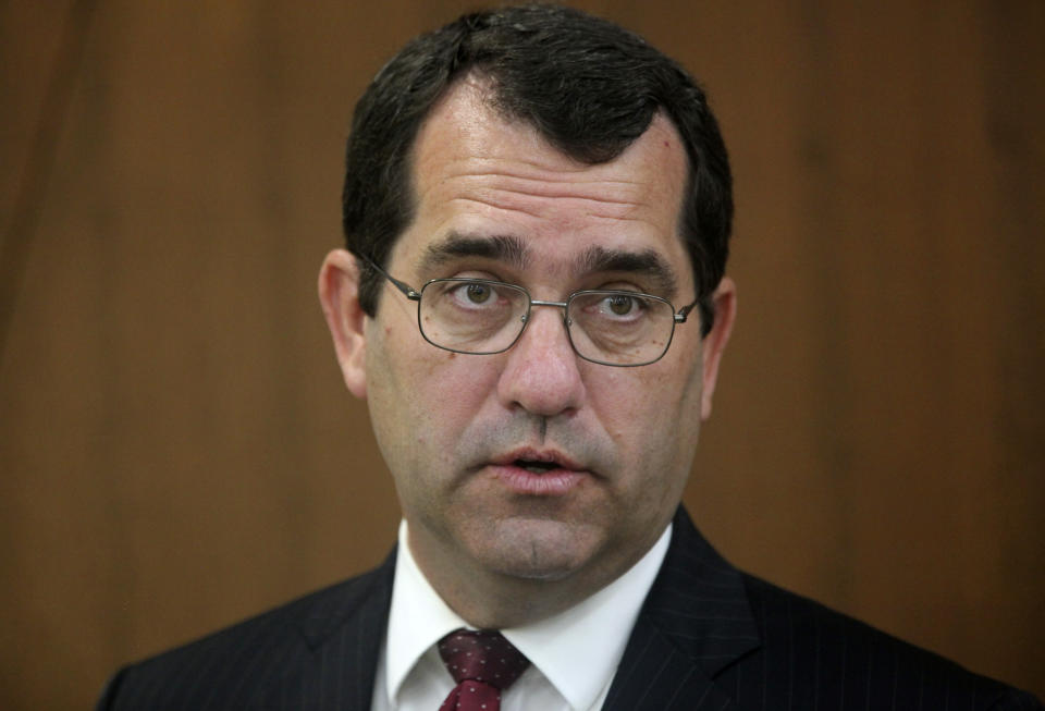 Kansas Attorney General Derek Schmidt, the Republican nominee for governor, answers questions from reporters during a news conference, Tuesday, Oct. 11, 2022, in Topeka, Kan. Schmidt says that when he told a racial justice commission in 2020 that racial bias "obviously" exists in policing, he wasn't saying there was systemic racism and he's standing by his attacks on Democratic Gov. Laura Kelly for using that phrase. (AP Photo/John Hanna)