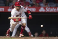 Los Angeles Angels' David Fletcher drops a sacrifice bunt during the sixth inning of the team's baseball game against the Detroit Tigers in Anaheim, Calif., Saturday, June 19, 2021. (AP Photo/Kyusung Gong)