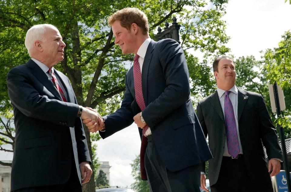 <p>Prince Harry greets McCain while arriving on Capitol Hill during the first day of his visit to the United States on May 9, 2013.</p>