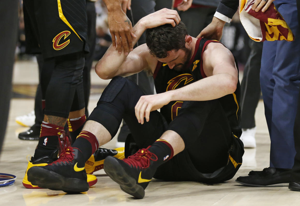 Cleveland Cavaliers’ Kevin Love sits on the court while holding his head during the first half of Game 6 of the team’s NBA basketball Eastern Conference finals against the Boston Celtics, Friday, May 25, 2018, in Cleveland. (AP Photo/Ron Schwane)