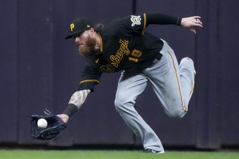 Pittsburgh Pirates' Ben Gamel makes a running catch on a ball hit by Milwaukee Brewers' Brandon Woodruff during the fourth inning of a baseball game Friday, June 11, 2021, in Milwaukee. (AP Photo/Morry Gash)