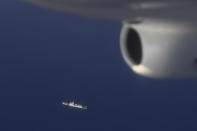 In this May 14, 2019, photo provided by the Philippine Coast Guard, a Chinese Coast Guard ship is seen while American and Philippine coast guards conduct joint search and rescue and capability-building exercises off the South China Sea west of the Philippines. Captain John Driscoll, commanding officer of the U.S. Coast Guard National Security Cutter Bertholf (WMSL 750), told reporters Wednesday, May 15, 2019, two Chinese Coast Guard ships were spotted off the South China Sea while they were conducting the joint exercise with Philippine Coast Guard. (Philippine Coast Guard Via AP)