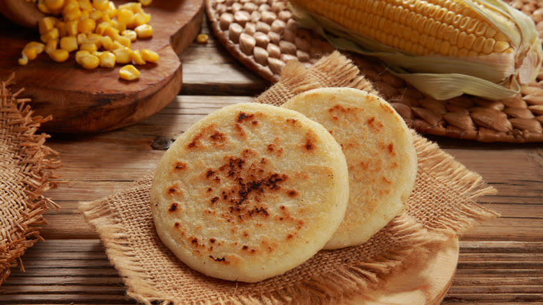 fried arepa on a rustic wood