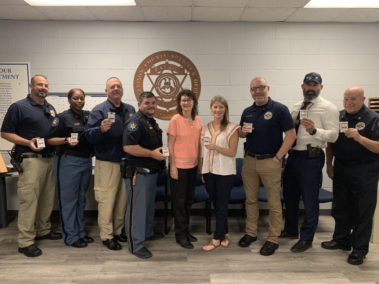 Employees at the Harrison County Sheriff's Office, which monitors the largest prison on the Mississippi coast, receive the cold case cards.   / Credit: Mississippi Coast Crime Stoppers