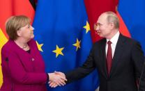 Russian President Putin and German Chancellor Merkel hold a joint news conference in Moscow