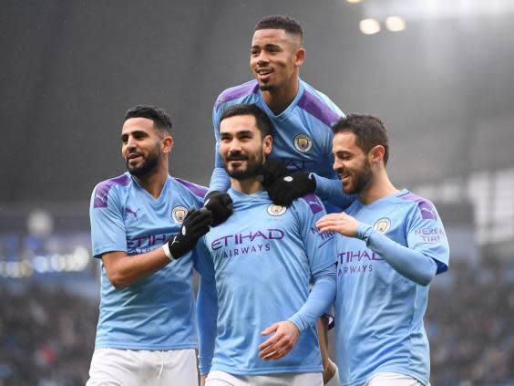 Manchester City midfielder Ilkay Gundogan with team-mates (Getty Images)