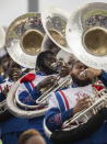 Jorge Pena, background from left, Daniel Neal, and Travis Young, members of the Tennessee State University marching band, perform during the Southern Heritage Classic football game in Memphis, Tenn., on Sept. 10, 2022. TSU is hoping to make history after their marching band was nominated for a Grammy in the roots gospel category. The historically Black university's Aristocrat of Bands teamed up with gospel songwriter and producer Sir the Baptist last year to record “The Urban Hymnal.” (Garrett E Morris via AP)