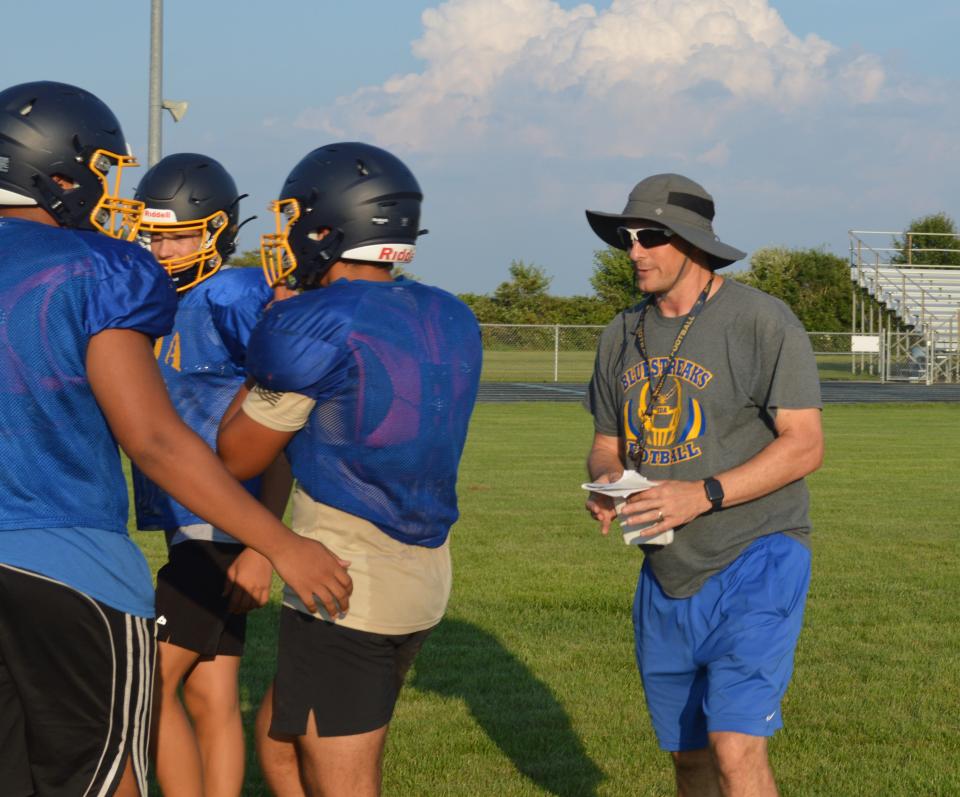 Ida football coach Jeff Potter gives instructions to his players during a recent practice.