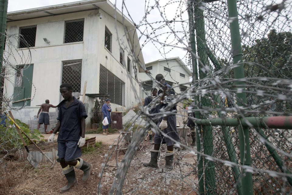 Somali inmates, detained in anti-piracy operations conducted by the Seychelles Coast Guard, work at the incarceration block in Montagne Posee near Victoria, Seychelles, Friday, March 2, 2012. (AP Photo/Gregorio Borgia)