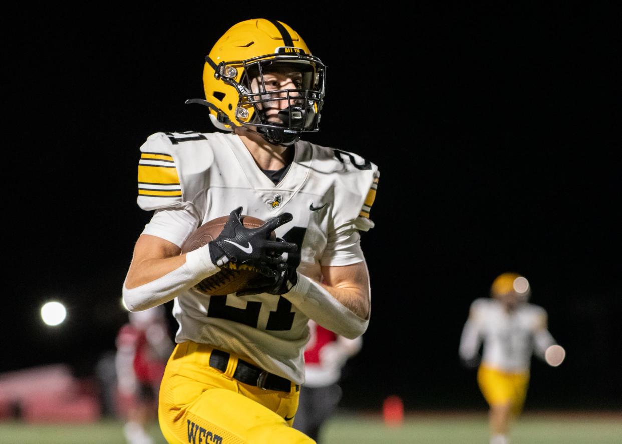 After making the interception, Central Bucks West cornerback Vance Morelli takes off down the sideline for a 51-yard touchdown in the Bucks' 35-14 win over Upper Dublin.