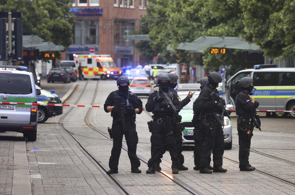 Police attend the scene of an incident in Wuerzburg, Germany, Friday June 25, 2021. German police say several people have been killed and others injured in a knife attack in the southern city of Wuerzburg on Friday. (Karl-Josef Hildenbrand/dpa via AP)