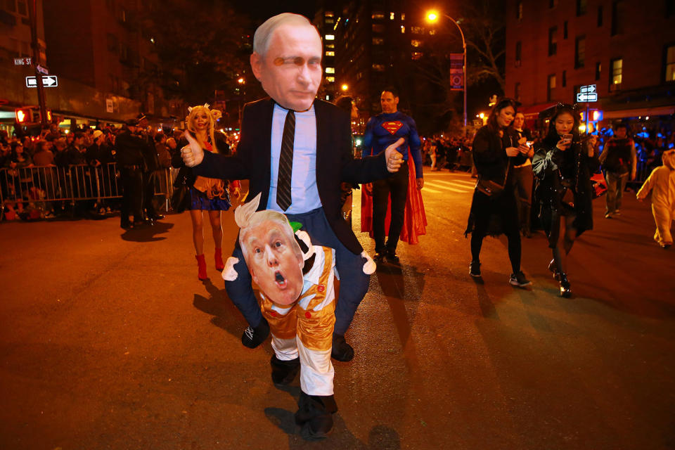 <p>A man dressed as Russian President Vladimir Putin gives a thumbs-up to specators while marching in the 44th annual Village Halloween Parade in New York City on Oct. 31, 2017. (Photo: Gordon Donovan/Yahoo News) </p>