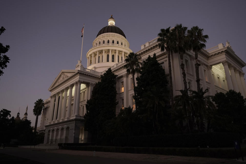FILE -- The lights of the state Capitol glow into the night in Sacramento, Calif., Aug. 31, 2022. California lawmakers are scheduled to return to work on Wednesday, Jan. 3, 2024. (AP Photo/Rich Pedroncelli, File)
