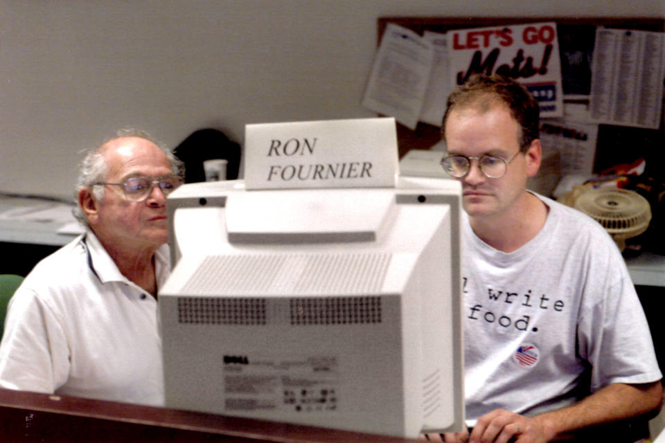 Associated Press journalists Ron Fournier, right, and Harry Rosenthal work on election night in Washington, November 2000. (AP Photo)