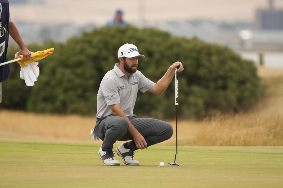 Cameron Young of the US lines up a putt on the 6th green during the third round of the British Open golf championship on the Old Course at St. Andrews, Scotland, Saturday July 16, 2022. (AP Photo/Gerald Herbert)