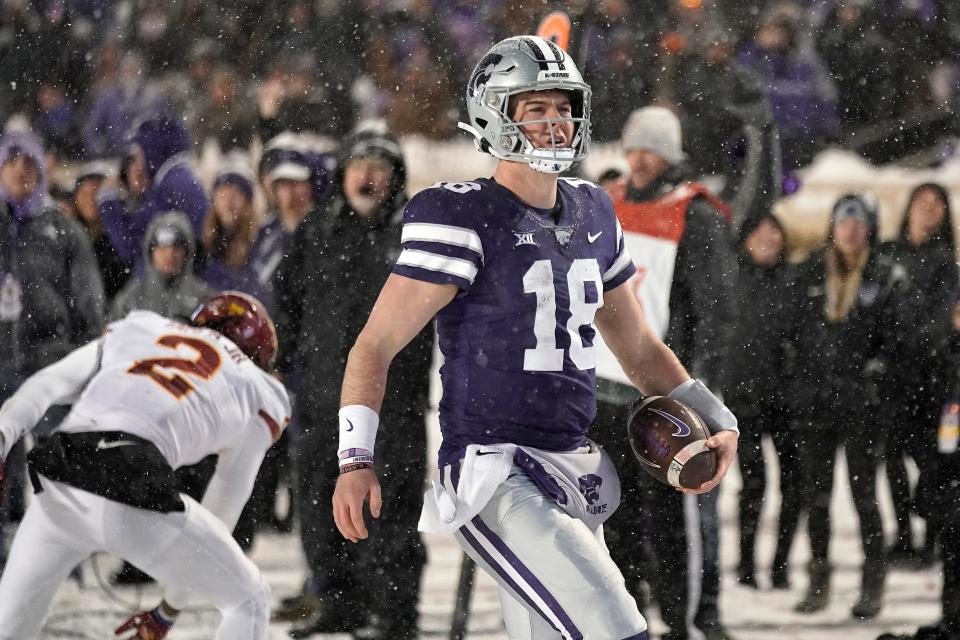 Kansas State quarterback Will Howard scores a touchdown during the second half of an NCAA college football game against Iowa State Saturday, Nov. 25, 2023, in Manhattan, Kan. (AP Photo/Charlie Riedel)