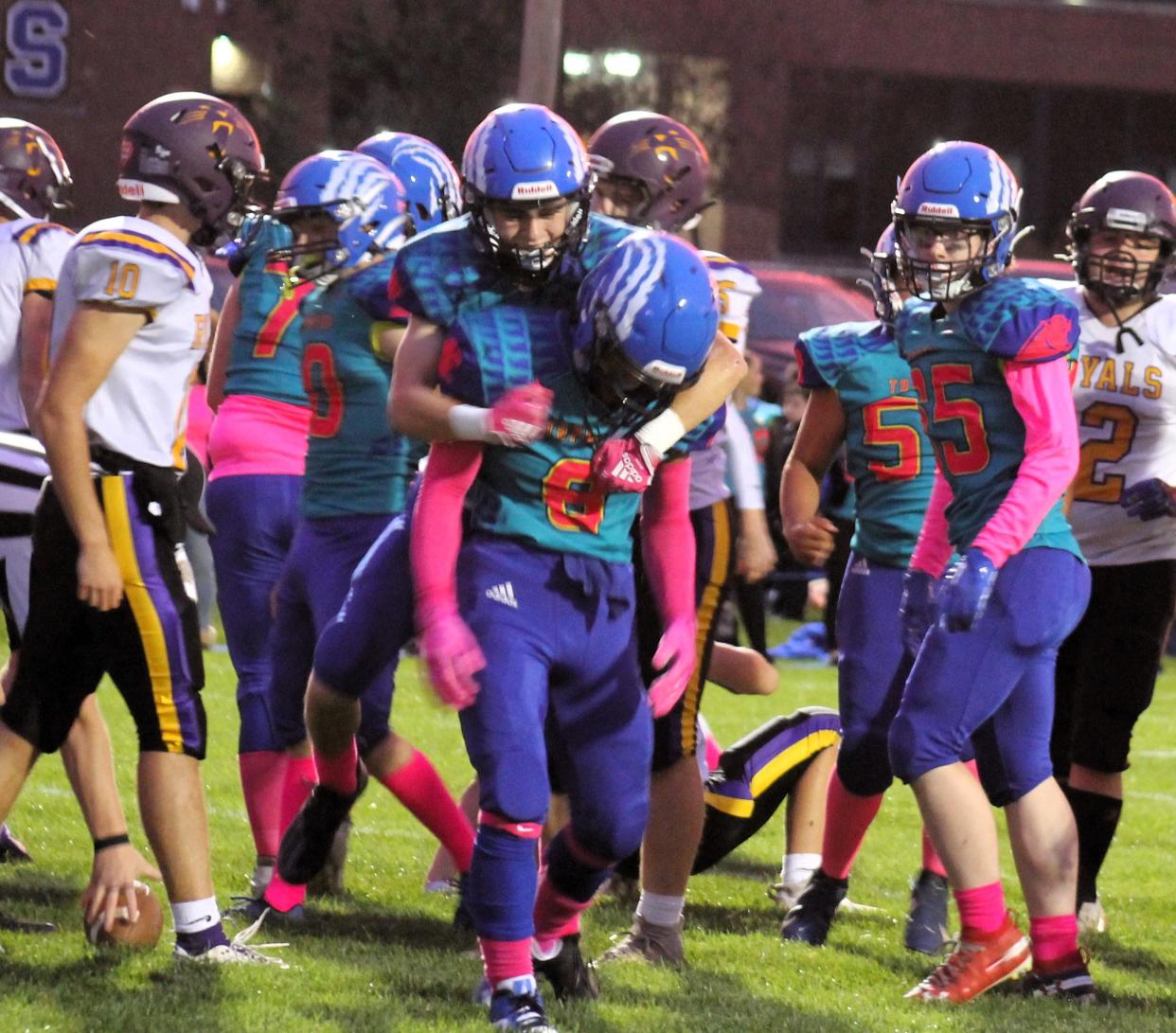 Somersworth's Tayshawn Sheppard (8) tries to squeeze through the Mascoma Valley defense during Friday night's Division IV contest.