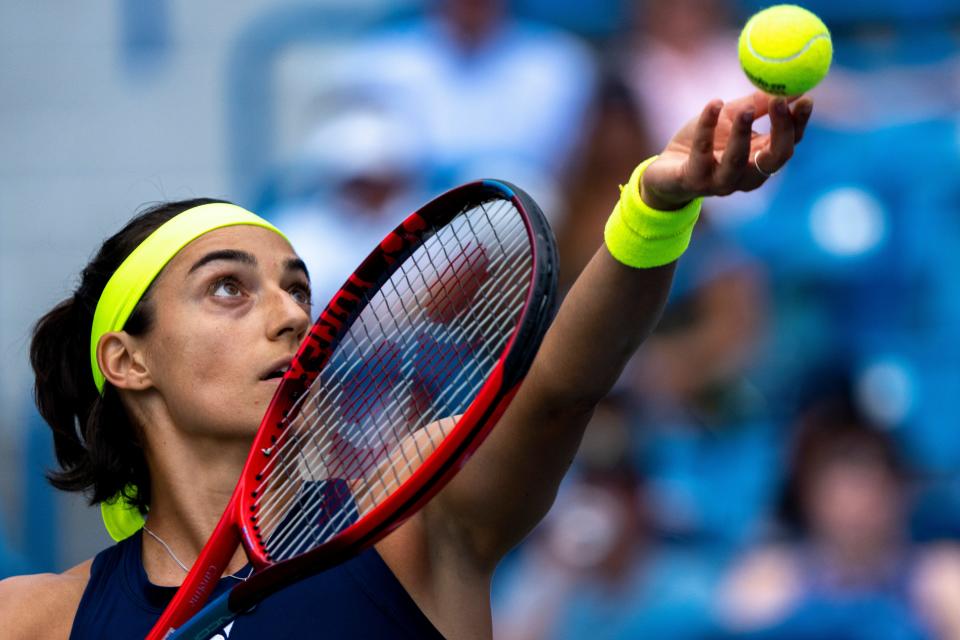Caroline Garcia serves to Petra Kvitova in the first set of the Western & Southern Open women’s final match at the Lindner Family Tennis Center in Mason, Ohio, on Sunday, Aug. 21, 2022. 