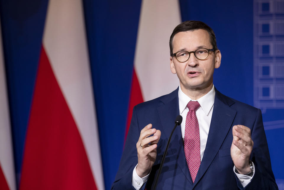 Poland's Prime Minister Mateusz Morawiecki speaks during a news conference following joint meetings of the government of the Lithuania and the government of the Poland at the Palace of the Grand Dukes of Lithuania in Vilnius, Lithuania, Thursday, Sept. 17, 2020. (AP Photo/Mindaugas Kulbis)