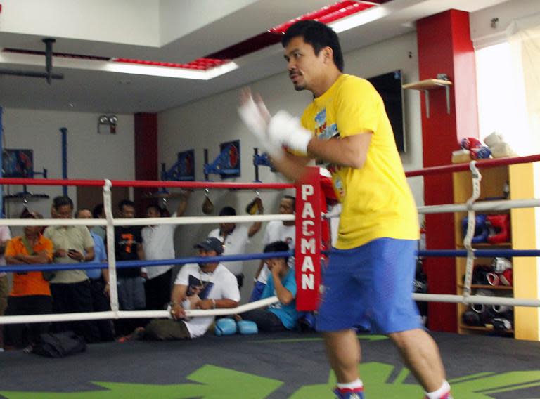 Philippine boxing superstar Manny Pacquiao trains for his upcoming bout with Chris Algieri, at a gym in General Santos City, on the southern island of Mindanao, on September 18, 2014