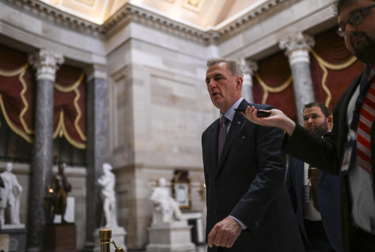 WASHINGTON, DC - JUNE 14: Speaker of the House Kevin McCarthy (R-Calif.) is questioned by a reporter as he walks back from the House floor for a meeting and legislative business at the U.S. Capitol on June 14, 2023 in Washington, D.C. (Photo by Ricky Carioti/The Washington Post via Getty Images)