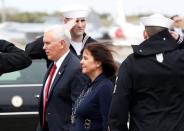 U.S. Vice President Mike Pence, flanked by his wife Karen, arrives at Atsugi naval air base in Ayase, south of Tokyo, Japan, April 18, 2017. REUTERS/Kim Kyung-Hoon