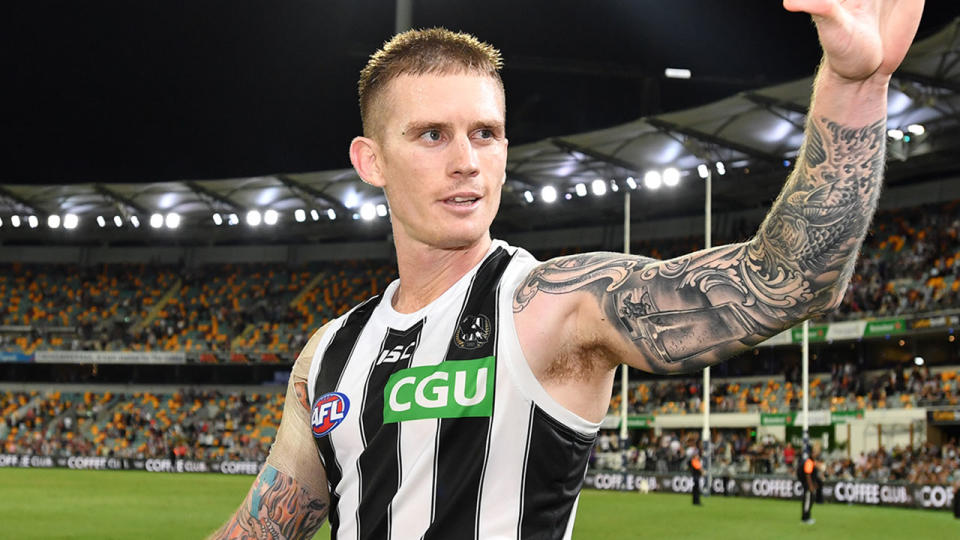Pictured here, Collingwood's Dayne Beams waves to the crowd after an AFL game.