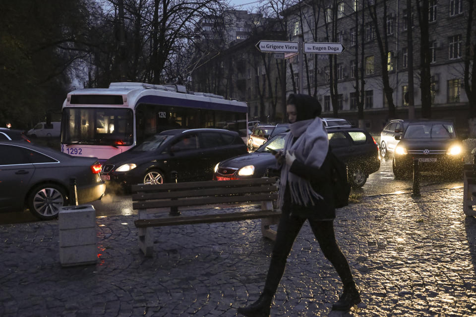 A trolley bus is stuck on a boulevard during a power outage in Chisinau, Moldova, Wednesday, Nov. 23, 2022. Moldova suffered massive power outages on Wednesday after Russian strikes on neighboring Ukraine's energy infrastructure left the small non-European Union country in the dark for the second time in little more than a week. (AP Photo/Aurel Obreja)