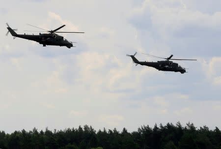 FILE PHOTO: Poland's Air Force helicopters MI-24 attend the final day of NATO Saber Strike exercises in Orzysz, Poland, June 16, 2017. REUTERS/Ints Kalnins