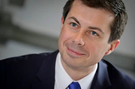 2020 Democratic presidential candidate Pete Buttigieg listens during a lunch meeting with civil rights leader Rev. Al Sharpton at SylviaÕs Restaurant in Harlem, New York, U.S., April 29, 2019. Bebeto Matthews/Pool via REUTERS