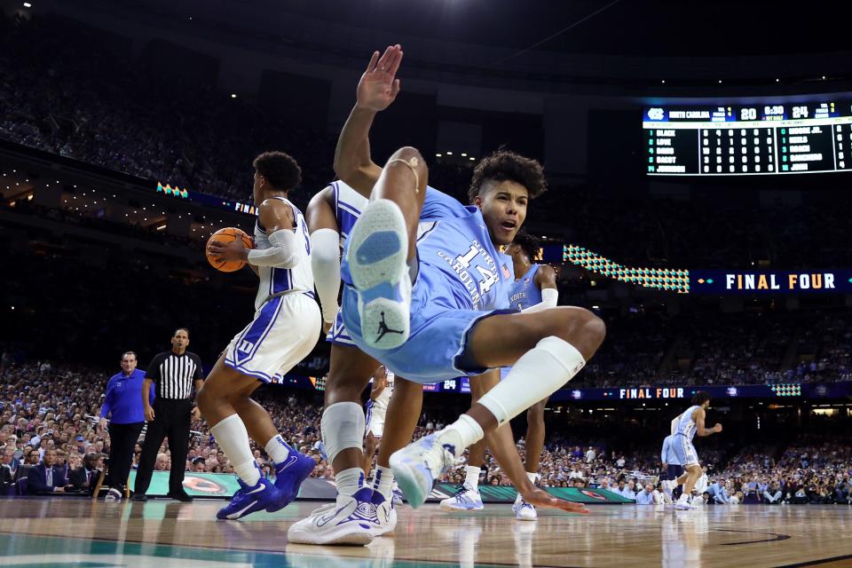 NEW ORLEANS, LOUISIANA - APRIL 02: Puff Johnson #14 of the North Carolina Tar Heels falls after shooting the ball in the first half of the game against the Duke Blue Devils during the 2022 NCAA Men's Basketball Tournament Final Four semifinal at Caesars Superdome on April 02, 2022 in New Orleans, Louisiana. (Photo by Jamie Squire/Getty Images)