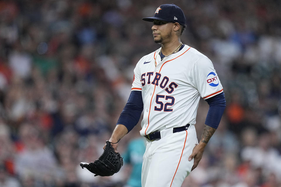 Houston Astros pitcher Bryan Abreu walks to the dugout after blowing a save during the eighth inning of a baseball game against the Seattle Mariners, Sunday, May 5, 2024, in Houston. (AP Photo/Kevin M. Cox)