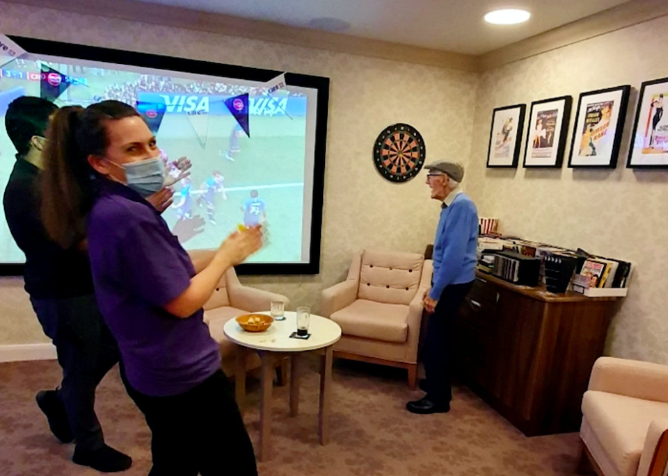 Staff at the care home put on regular quizzes, cocktail nights and screens live sports on a giant TV for residents. (SWNS)