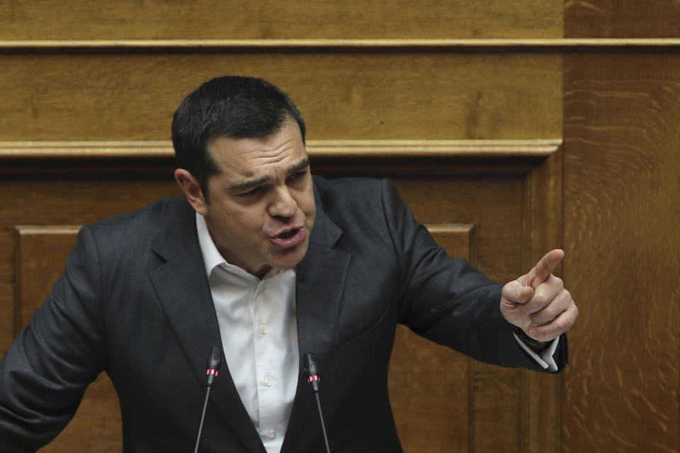 Greek Prime Minister Alexis Tsipras speaks during a parliamentary session in Athens, on Tuesday, Jan. 15, 2019. Greece's prime minister is defending his deal to normalize relations with neighboring Macedonia ahead of a confidence vote in parliament after his governing coalition collapsed over the agreement. (AP Photo/Petros Giannakouris)