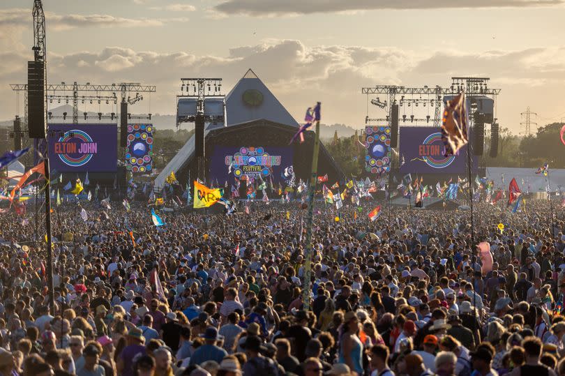 GLASTONBURY, ENGLAND - JUNE 25: The crowd gathers to watch Elton John perform on the main Pyramid Stage on Day 5 of the Glastonbury Festival 2023 held at Worthy Farm, Pilton on June 25, 2023 in Glastonbury, England. The festival, founded in 1970, has grown into one of the largest outdoor green field festivals in the world.(Photo by Matt Cardy/Getty Images)