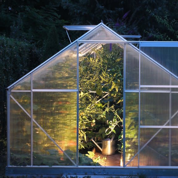  A greenhouse lit up at night. 